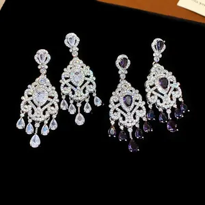 Macro view of French retro court style teardrop earrings with purple and white zircons