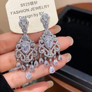 Detailed macro view of French vintage palace style cubic zirconia teardrop earrings