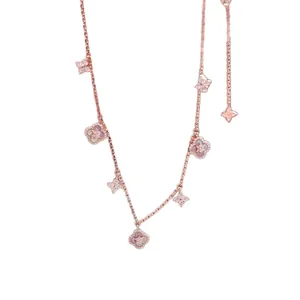 Rose gold clover bracelet with sparkling zircons and mother of pearl flower charms