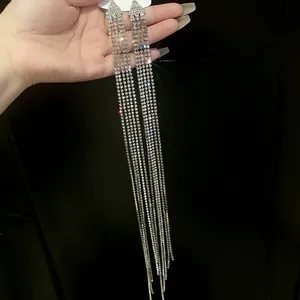 Long rhinestone tassel earrings with silver needle in sparkling silver finish