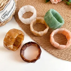 Set of vintage acrylic marbled rectangular elastic bracelets in various earth tones
