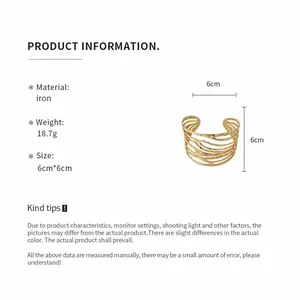 Golden twisted metal open cuff bracelet with minimalist 6cm diameter design