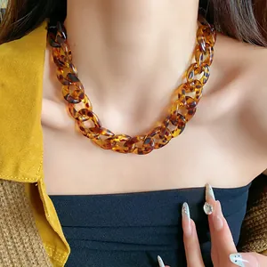Close-up detail of retro tortoiseshell acrylic chunky chain necklace for women