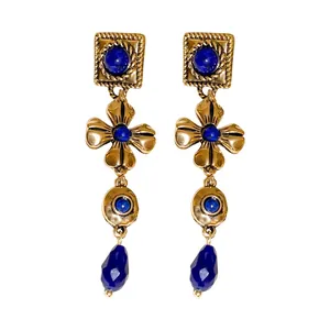 Vintage gold-tone drop earrings featuring blue floral charms and faceted teardrop beads