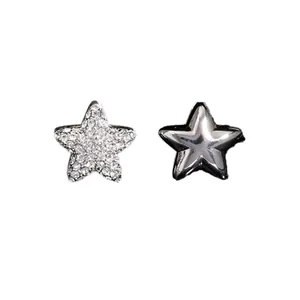 Pair of minimalist five-pointed star stud earrings with zircon stones and silver finish
