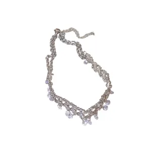 Elegant silver-toned necklace featuring shimmering dangling cubic zirconia stones