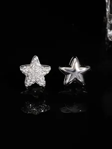 Pair of elegant silver star-shaped earrings with shimmering zircon stones