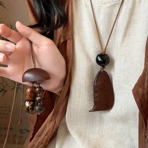 Retro Neo-Chinese style minimalist pendant necklace with wooden beads and earthy tones