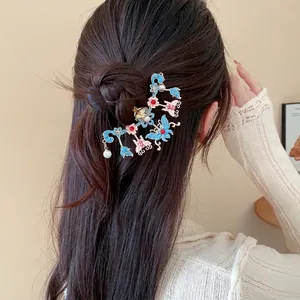 Elegant New Chinese style butterfly and flower hairpin with pearl accents on a hair bun