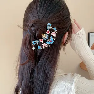 Close-up detail of elegant New Chinese style hair pin with butterfly and pearl on hair bun