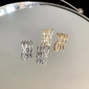 Fashionable criss-cross multi-layer zircon ear cuffs available in gold and silver finishes