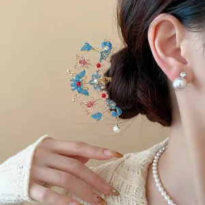 Detailed close-up of new Chinese hair stick with enamel flowers and pearl drop