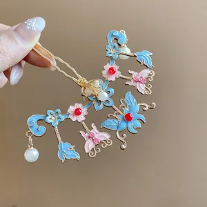 Detail shot of elegant Chinese hair stick featuring butterfly and floral enamel designs