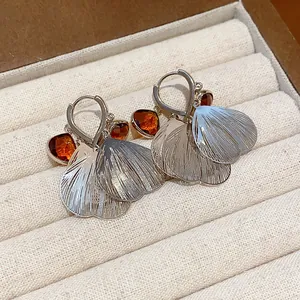Vintage silver petal tassel earrings with amber glass stones in jewelry box