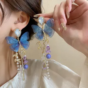 Elegant blue mesh butterfly tassel earrings with crystals and intricate golden leaf details