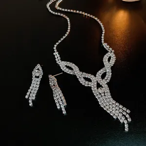 Close-up view of elegant silver rhinestone tassel necklace and earring jewelry set