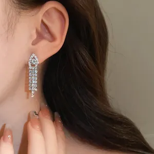 Elegant rhinestone tassel earrings for evening banquet wear, shown on model