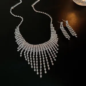 Macro detail showing the sparkling rhinestone fringe of the tassel necklace and earrings set