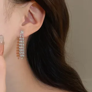 Sparkling silver tassel drop earrings featuring multiple rows of brilliant rhinestones