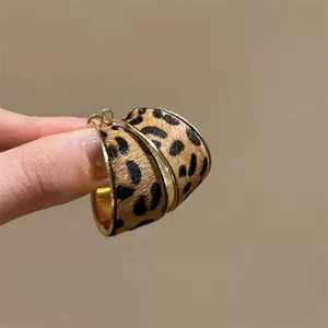 Vintage leopard print hoop earrings with polished golden edges for autumn or winter