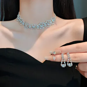 Elegant silver-toned rhinestone choker necklace and matching dangle earrings set