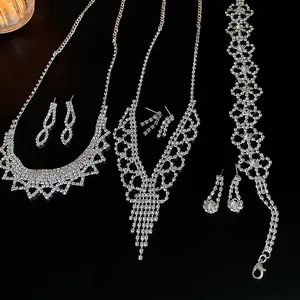 Detailed view of silver rhinestone jewelry set with fringe necklaces and earrings