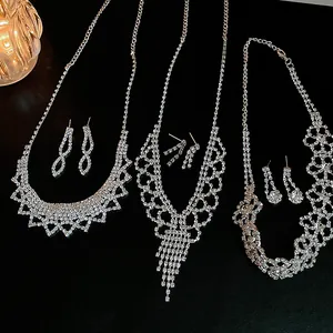 Detailed macro view of three sparkling rhinestone tassel necklace and earring banquet sets