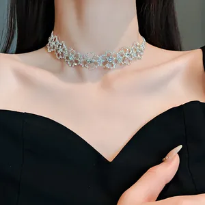 Exquisite close-up of a sparkling diamond choker necklace featuring a floral lace pattern design