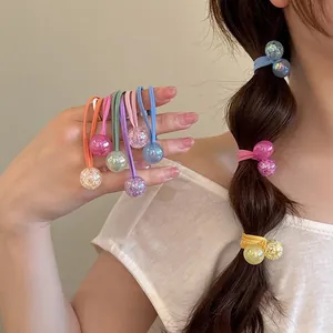 Close-up view of colorful bubble hair ties used in a stylish braided hairstyle for women