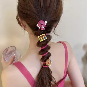 Close-up of colorful M&M's cartoon telephone line hair ties on a bubble braid hairstyle.