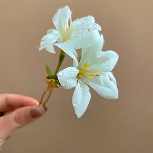 Handmade white fabric flower hair fork with realistic dew drops for vacation style