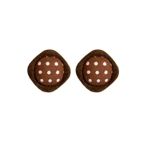 Handmade retro brown fabric stud earrings with white polka dots on white background