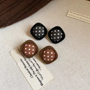 Retro vintage fabric button stud earrings with polka dot patterns in brown and black colors