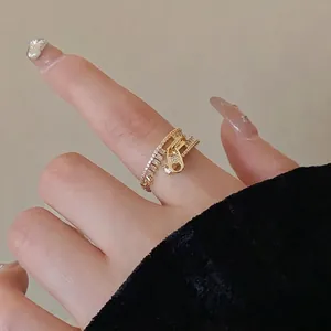 Creative gold zipper-shaped open ring with sparkling zircons worn on index finger