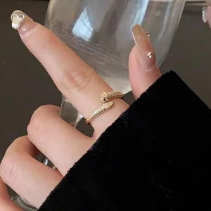 Elegant gold-tone snake open ring paved with sparkling zircons, luxury jewelry for women