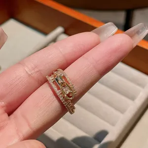 Close-up of a luxury gold-plated ring featuring a unique micro-pave zircon zipper design