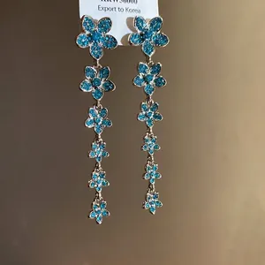 Elegant silver needle long tassel earrings featuring blue zircon flower charms for women