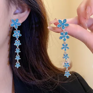 Elegant blue flower tassel earrings with sparkling zircon stones shown in detail