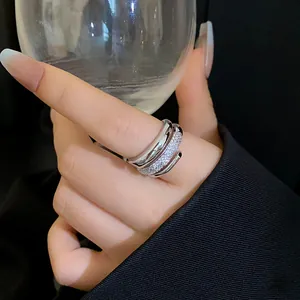 Close-up of elegant silver-toned wrap ring with shimmering micro-pave cubic zirconia stones