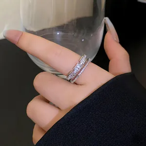 Close-up of elegant double-layered silver ring with sparkling zirconia stones