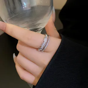 Close-up detail of silver-plated double-layer zircon ring featuring baguette-cut stones.