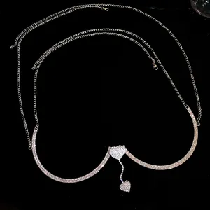 Elegant detail showing the sparkling silver rhinestone heart charms on a body chest chain