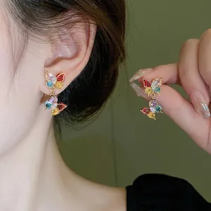 Exquisite colorful butterfly zircon earrings on model for a trendy look