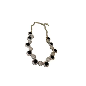 Luxury geometric rhinestone necklace with black gemstones and silver chain.