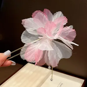 Close-up detail of a layered 3D chiffon flower hairpin featuring an elegant pearl tassel