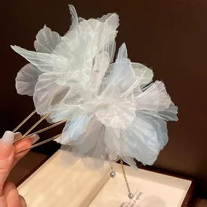 Close-up detail of a vintage 3D chiffon flower hair pin featuring elegant pearl tassels.