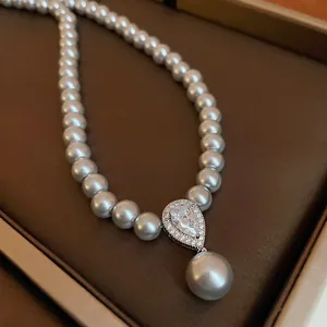 Exquisite detail of a French retro gray pearl necklace with teardrop zircon pendant.