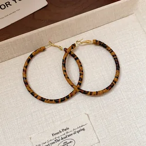 Large leopard print hoop earrings with elegant brown and black patterned texture