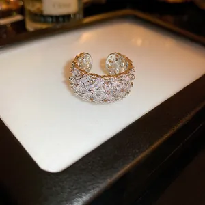 Close-up of elegant silver-tone open ring with sparkling cubic zirconia lattice design