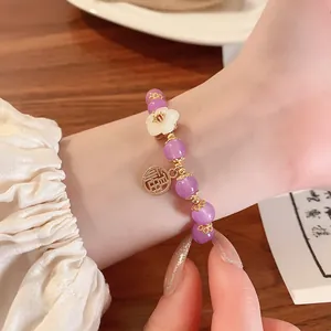Elegant traditional Chinese style purple glass bead bracelet with flower and blessing charms